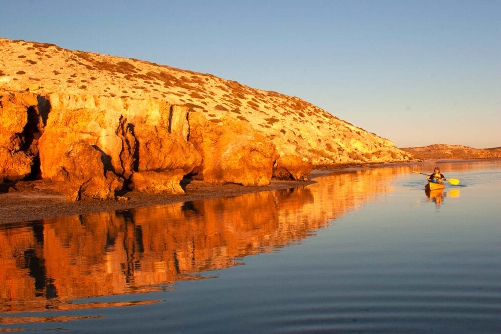 Ultimate Guide To the Peninsulas of Shark Bay World Heritage Area, WA. Coral Coast, Western Australia. Photos by Jane Pelusey. kayak, sunset, red cliffs