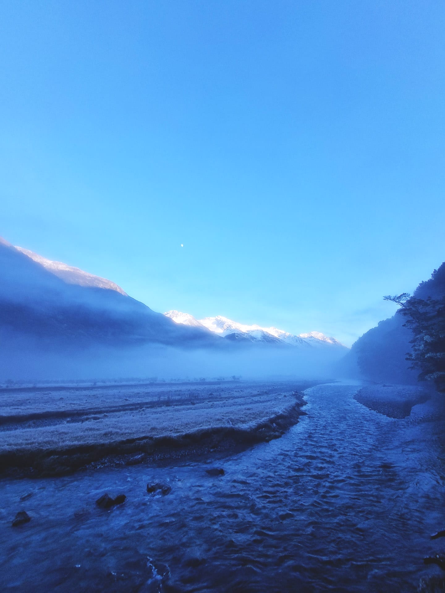 The Greenstone-Caples Track Is The Most Dynamic Hike in New Zealand, Photo by Lachlan Pearce, multi-day hike, new zealand hike, alpine hiking, back country hiking, a snowy caples valley seen from the greenstone-caples track