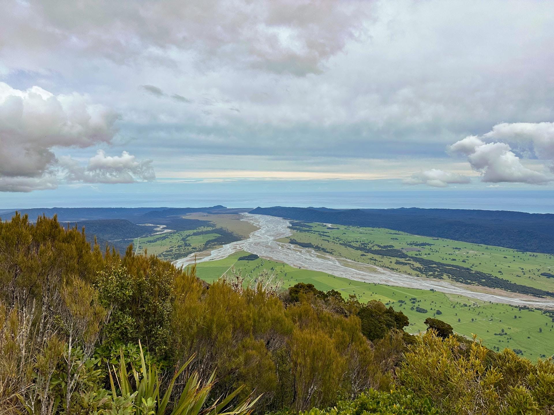 Mount Fox Route – New Zealand’s Fox Glacier’s Greatest Scramble, Photo by Connor Fisher, nz hikes, fox glacier, day hike, view halfway up the mount fox route with scenes of the glacial runoff and the Tasman sea