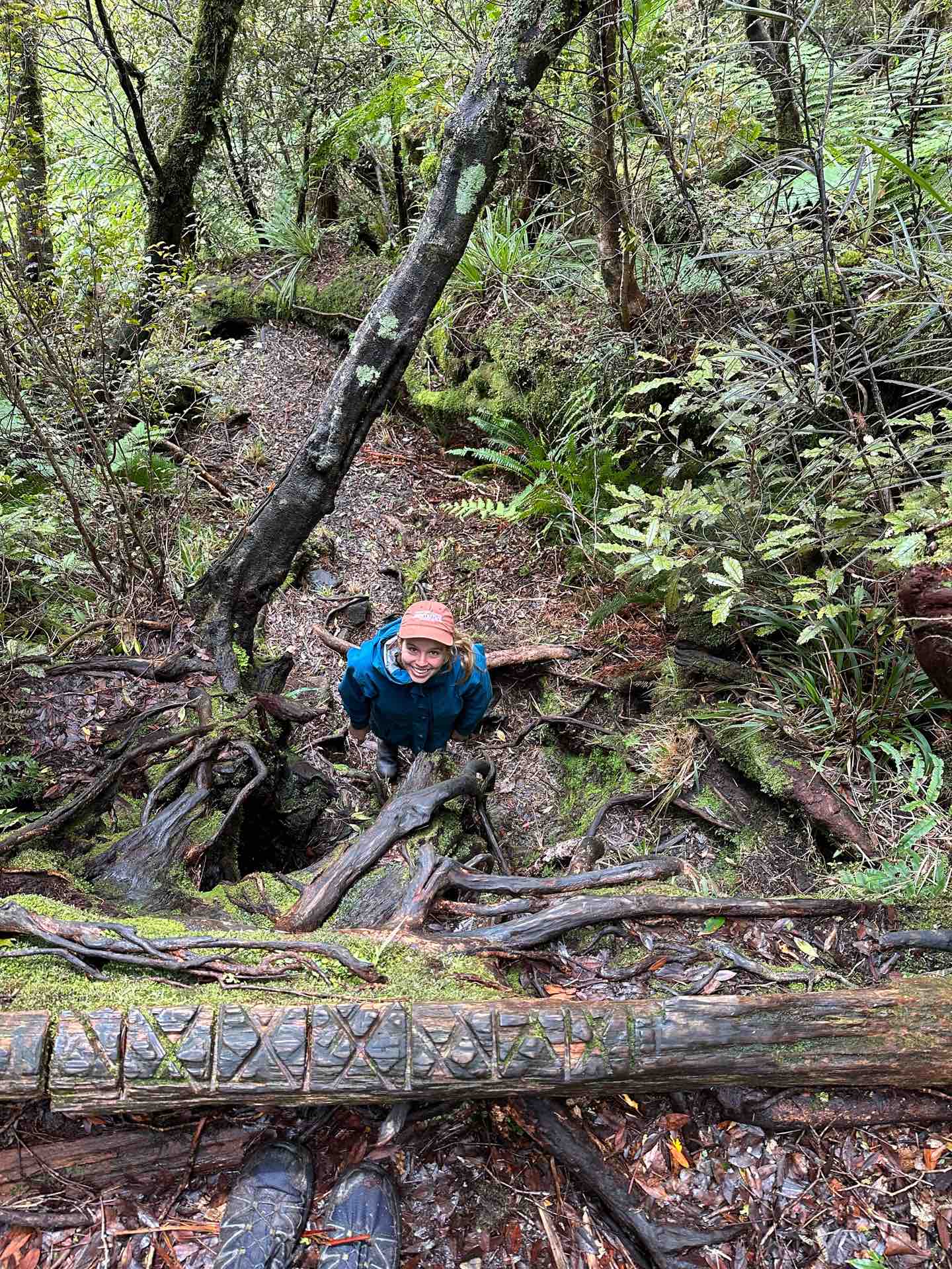 Mount Fox Route – New Zealand’s Fox Glacier’s Greatest Scramble, Photo by Connor Fisher, nz hikes, fox glacier, day hike, hiker smiling up on the mount fox route