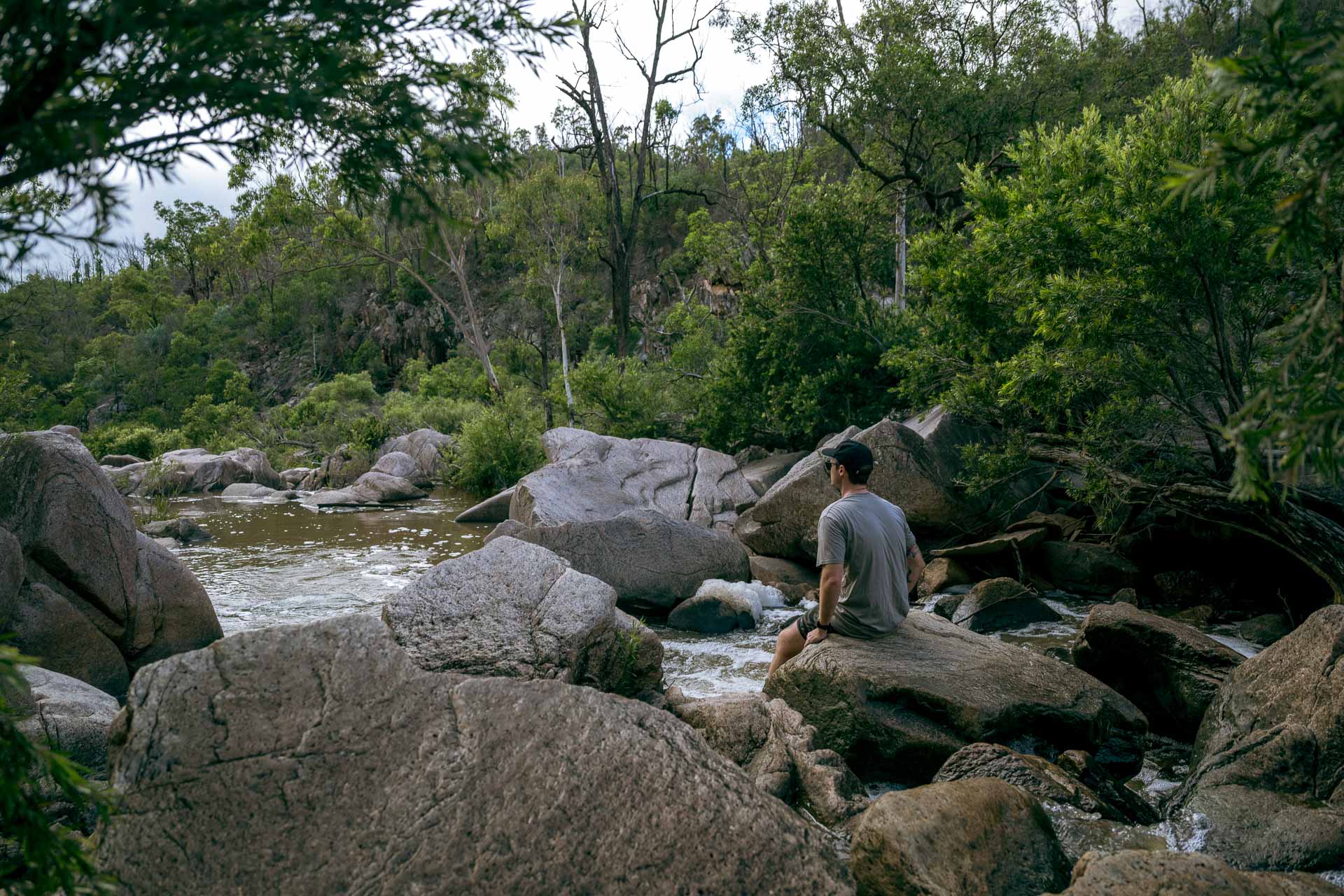All the Adventures We Unearthed on a Trip to Southern Country Queensland, Photo by Rian Cope, queensland, southern queensland country, road trip, sitting on boulders at the cascades in crows nest national park