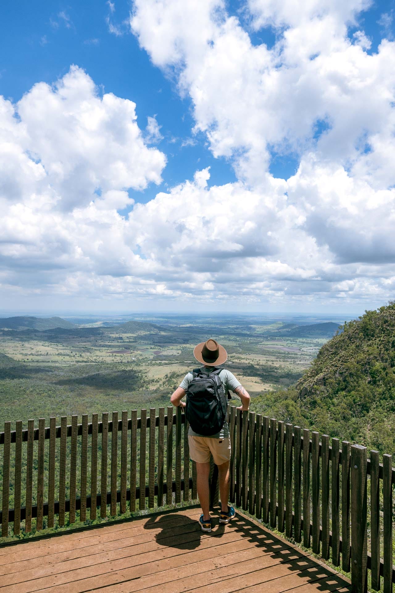All the Adventures We Unearthed on a Trip to Southern Country Queensland, Photo by Rian Cope, queensland, southern queensland country, road trip, hiker looking at the view of the western downs from the lookout on the kondaii circuit