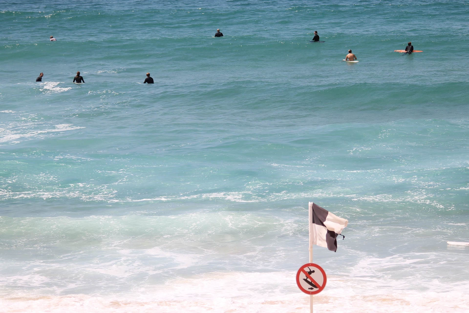 Can You Still Surf Alone in Australia? 5 Tips For Scoring Uncrowded Waves, Photos by Ben Dawson, surfer, surfboard, flag