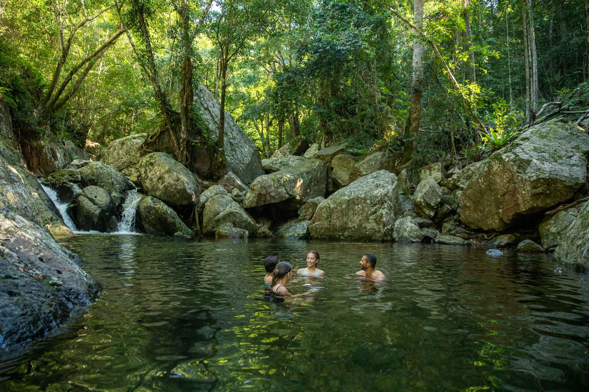 What It's Like to Compete in an MTB Event (& Why You Should Enter the UCI Masters MTB Championships in Cairns), Photo from TTNQ, Family swimming in Stoney Creek near Cairns