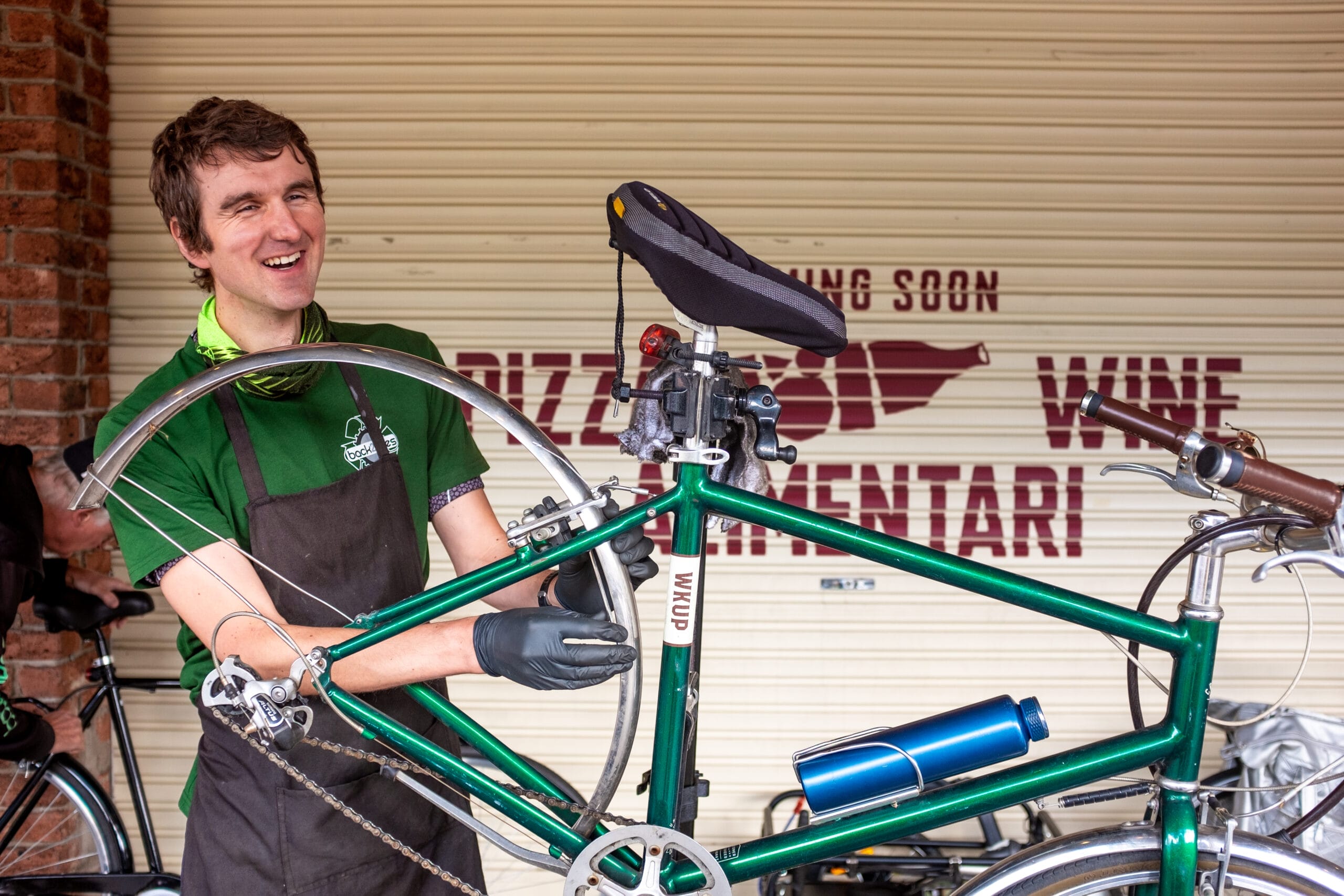 Sustainable Port Phillip Bike Charity is Donating Bikes to People in Need, photo by Jordan Tranter, charity, South Melbourne Market, smiling, bicycle