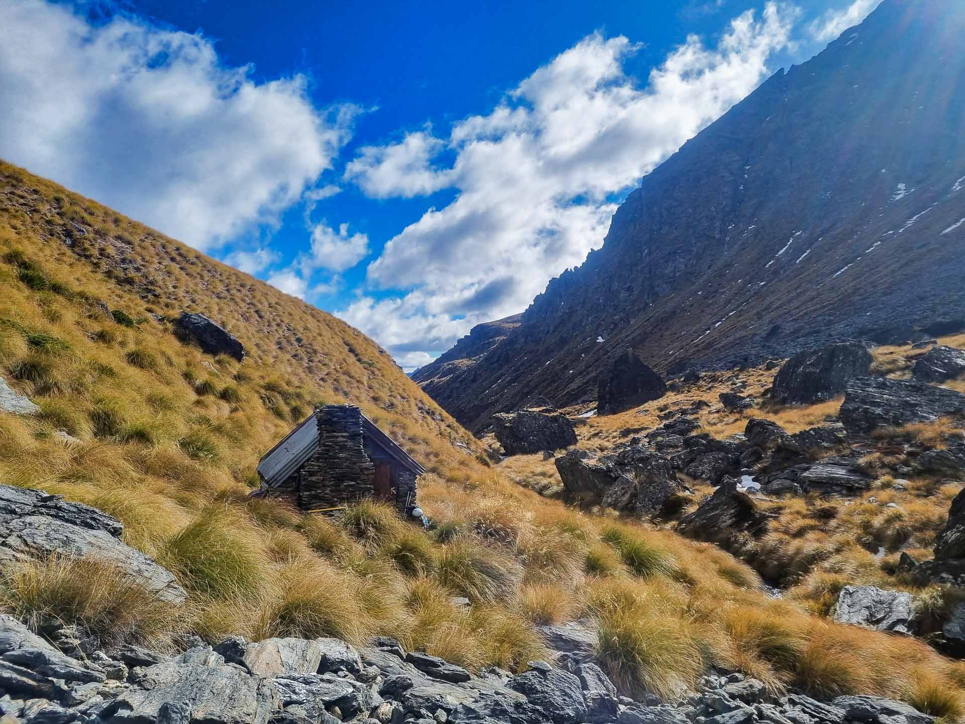This Stone Hut Near Queenstown Epitomises the NZ Backcountry, Photos by Lachlan Pearce, rmountain, blue sky