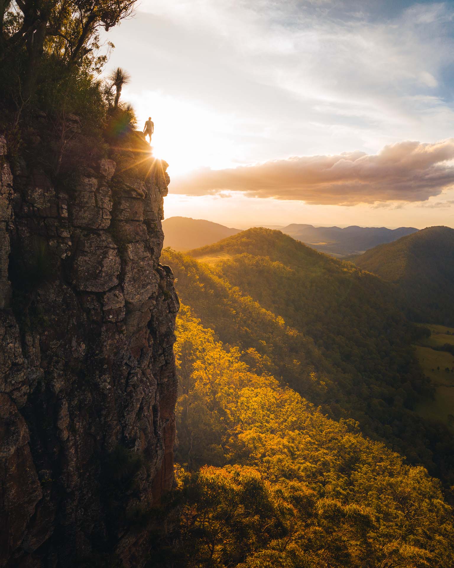 Turn Your Passiong For Adventure Photographer & Filmmaking Into Your Career, photo by Reuben Nutt, hiking, mountain, cliff, sunset, sunrise, hiker