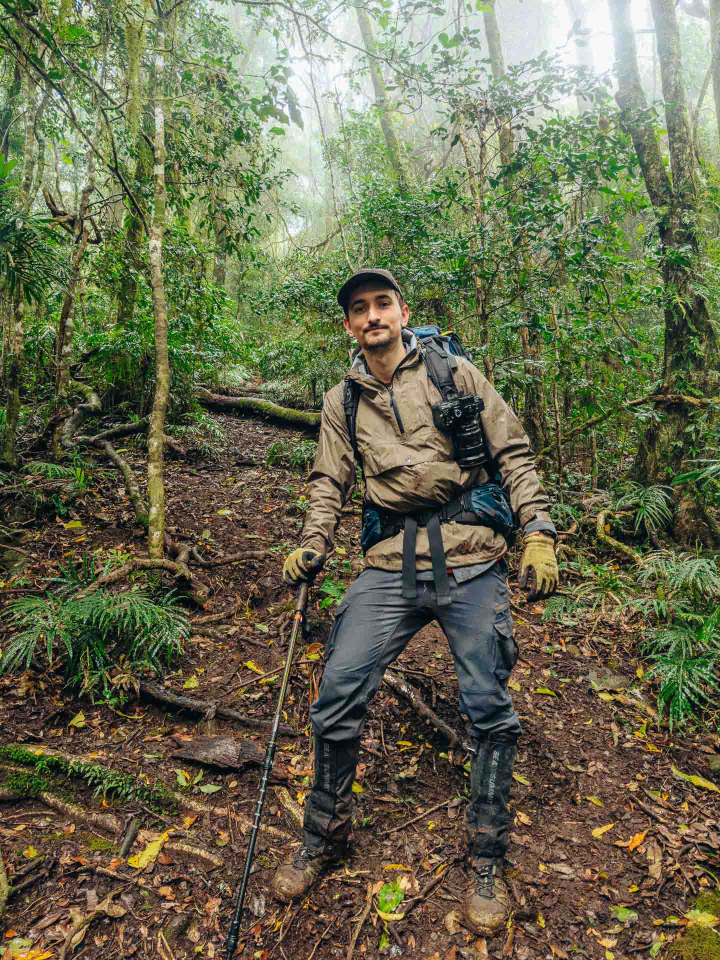 Turn Your Passiong For Adventure Photographer & Filmmaking Into Your Career, photo by Reuben Nutt, mud, hiking, hill, hiking pole, gaiters