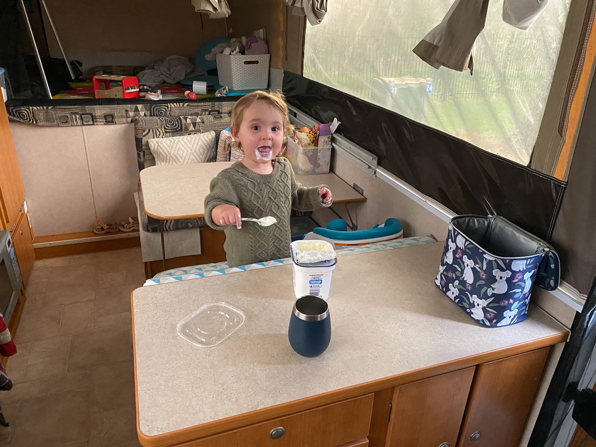 Cooking Sarahs Camper trailer and daughter