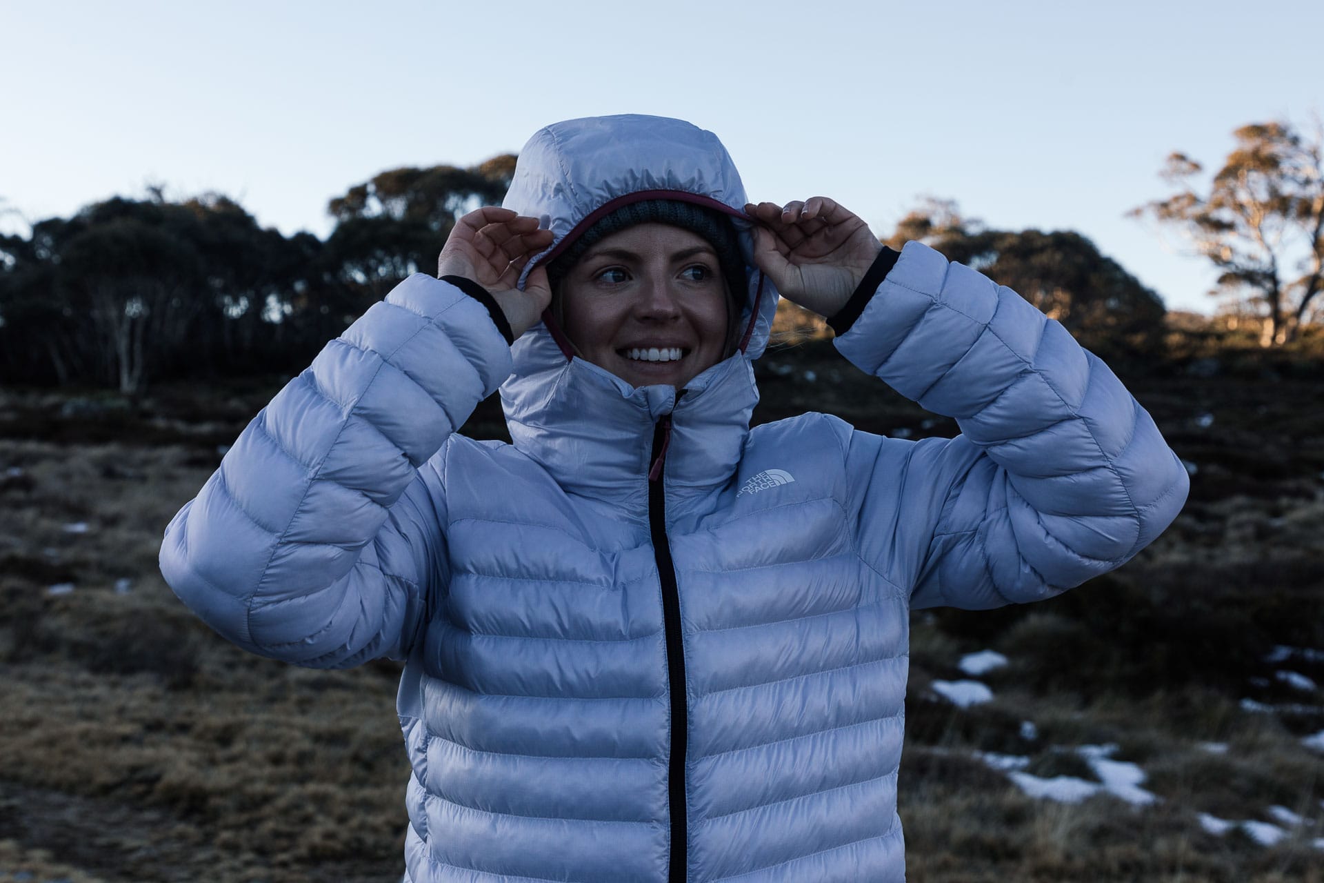 Winter Layering for the Outdoors – Our Layer-by-Layer Guide, photo by Matt Wiseman, Model Rachel Holland, NSW, Kosciuszko, snowy mountains, puffer jacket hood