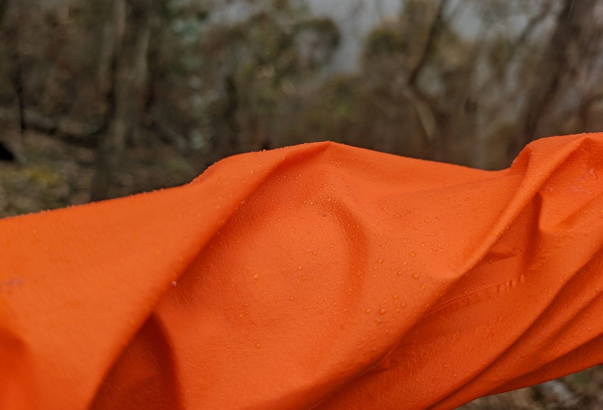 Mont Lightspeed Rain Jacket, by Ryan and Emily, orange jacket, water repellent, PFA-free DWR coating, outdoor gear, hiking, ultralight