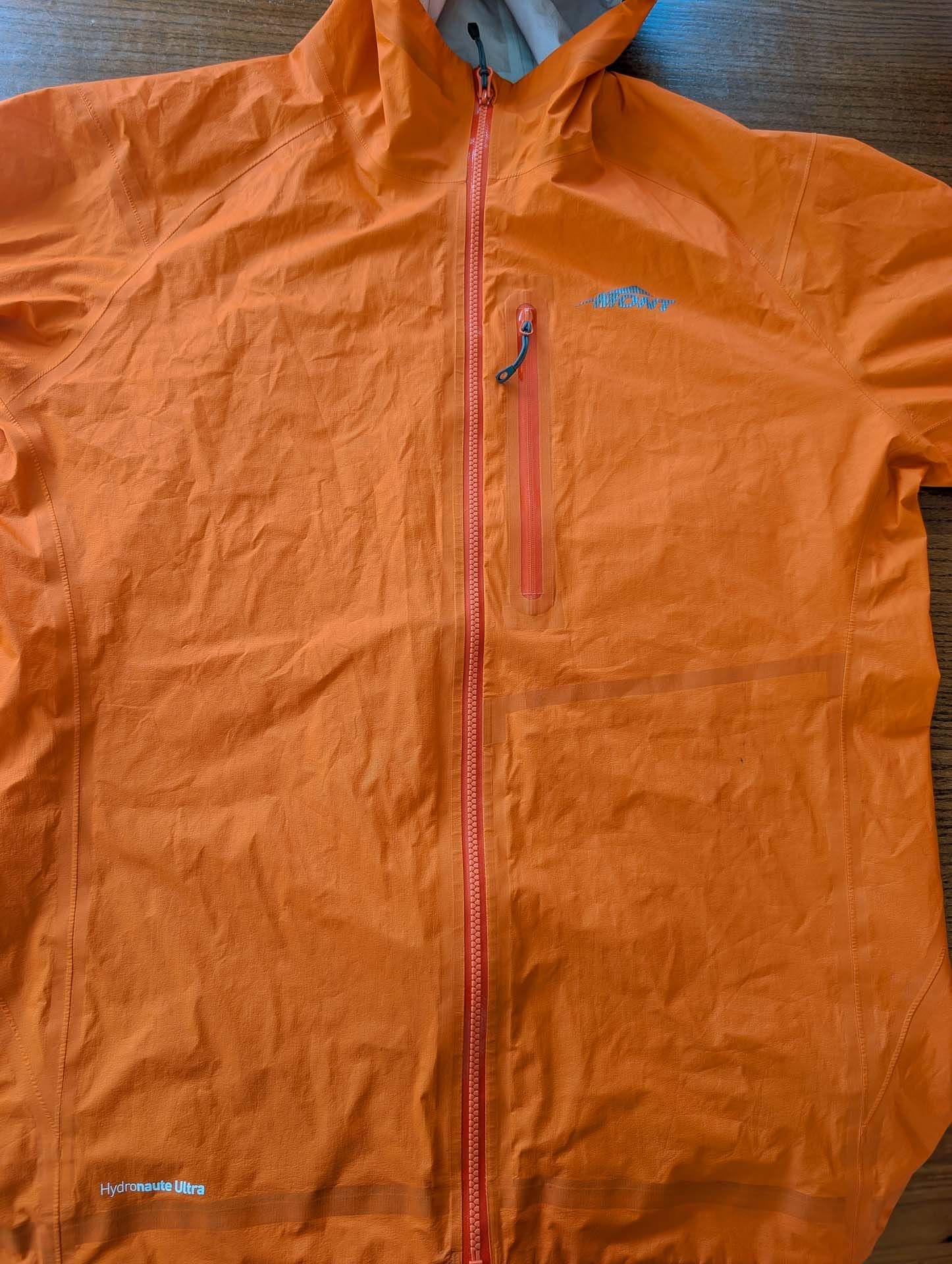 Mont Lightspeed Rain Jacket, by Ryan and Emily, firecracker orange, flat lay, waterproof, breathable, lightweight, Hydronaute Ultra, outdoor gear, review