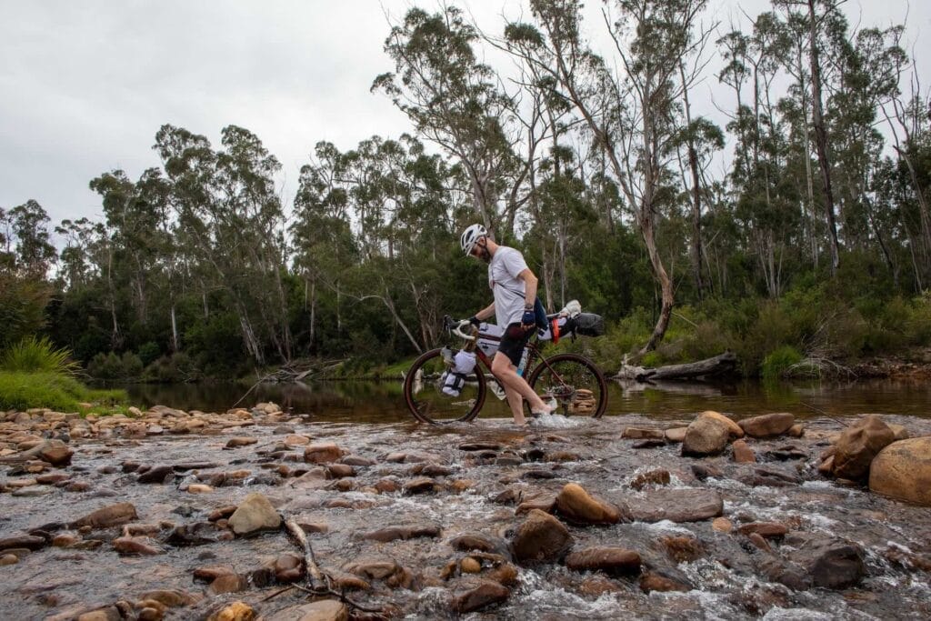 Attack of the Buns, Budawangs NSW, by Mattie J. Gould, bikepacker, cyclist, wading, creek crossing, adventure, wilderness
