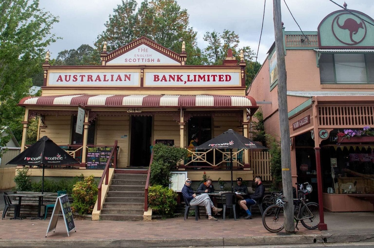 Historic Australian bank building, cafe, outdoor dining, bikepacking route stop, country NSW, Mattie J Gould, Attack of the Buns, Southern Tablelands, Southern Highlands, old architecture, bicycle