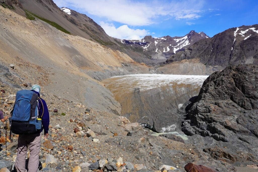 Huemul Trek, Southern Patagonia, Los Glaciares National Park, Viedma Glacier, by Hayley, hiker, trekking, rocky path, glacier, snow-capped mountains, vast landscape, wilderness, El Chaltén