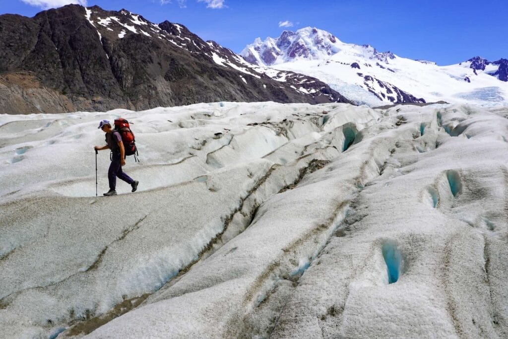 Huemul Trek, Patagonia, Argentina, glacier crossing, hiker, backpack, trekking pole, mountains, snow, ice, crevasses, meltwater, Los Glaciares National Park, El Chaltén, Southern Patagonian Ice Field, by Hayley