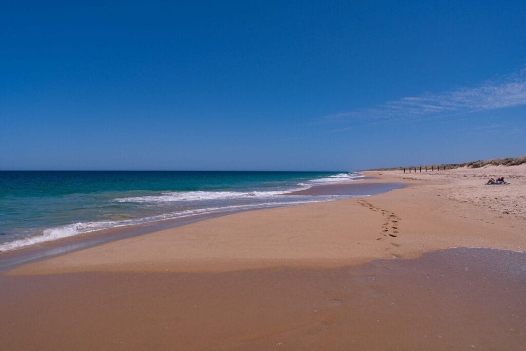 Preston Beach, by Lisa Ikin, sandy beach, blue ocean, clear sky, footprints, dunes, Western Australia, Yalgorup National Park, relaxing