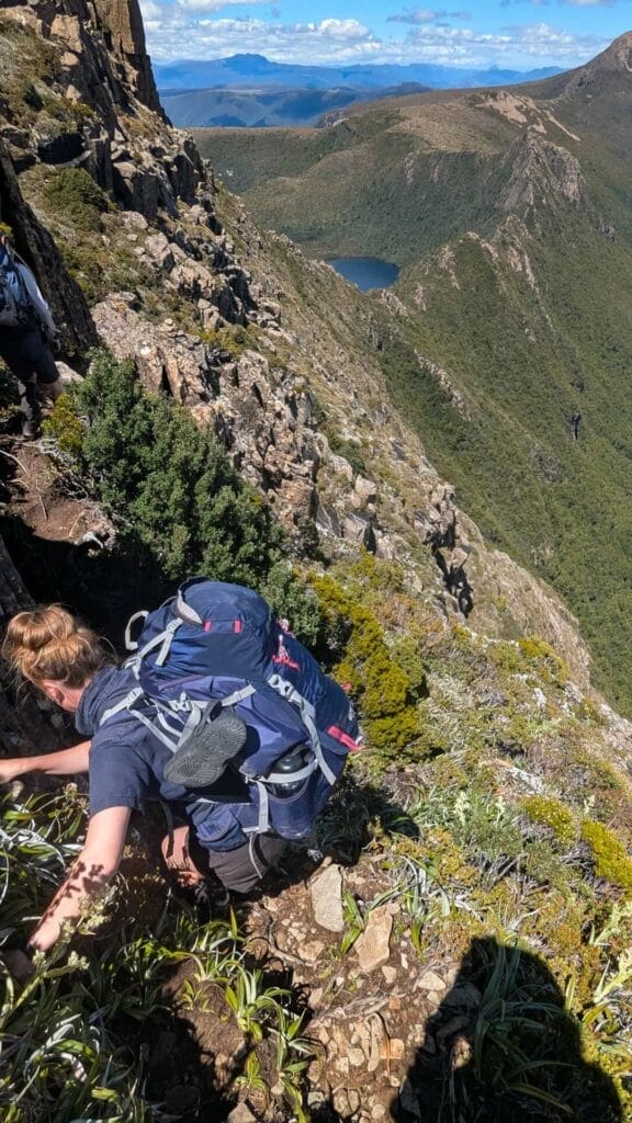 Mount Anne Circuit, Tasmania, Beyond the Notch, Lightning Ridge, by Katie Newfield, hiker scrambling, rocky trail, steep mountain, alpine landscape, multi-day hike, Southwest National Park