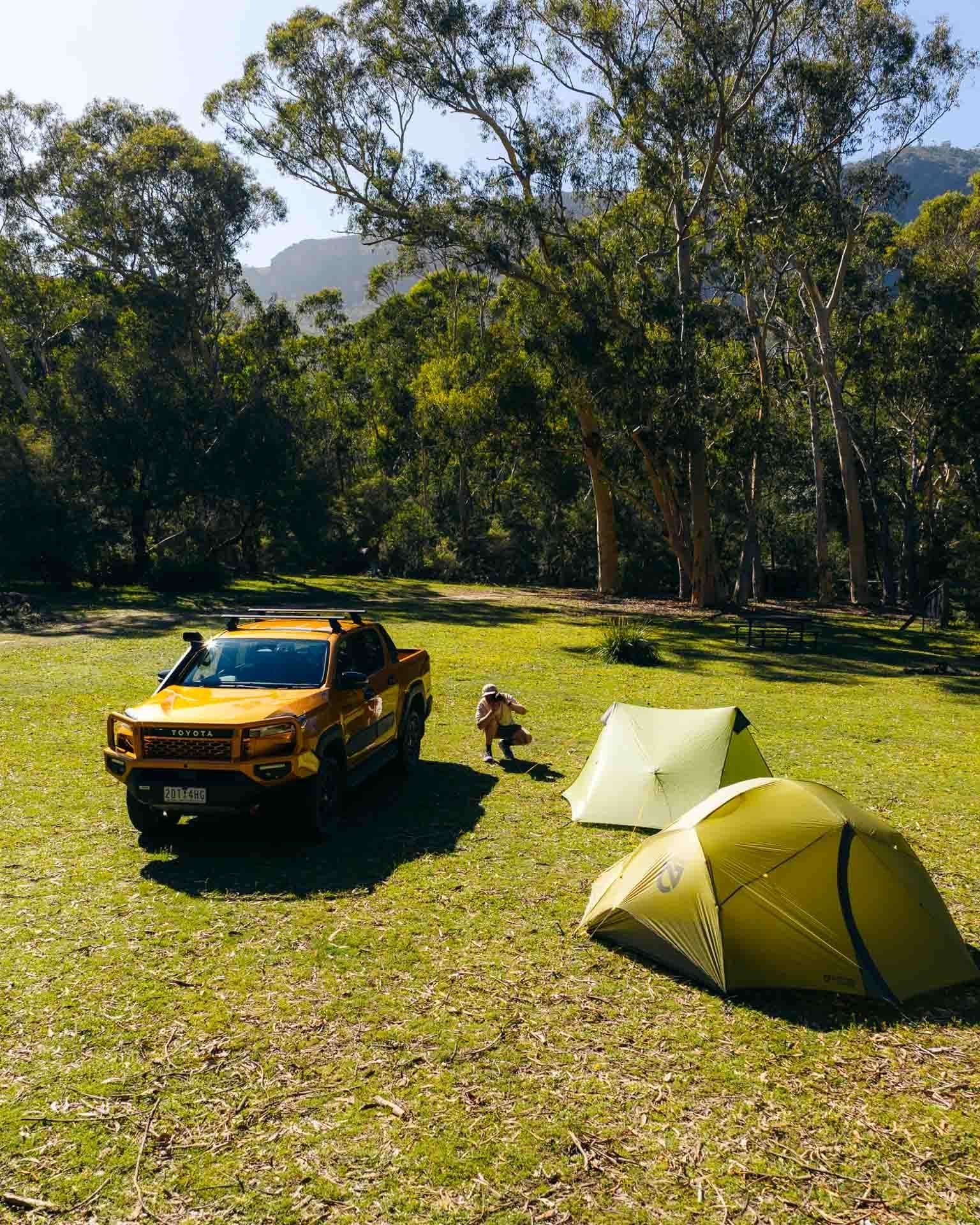 Toyota HiLux, camping, Australian bush, by Paul, grassy clearing, tents, outdoor adventure, We Are Explorers