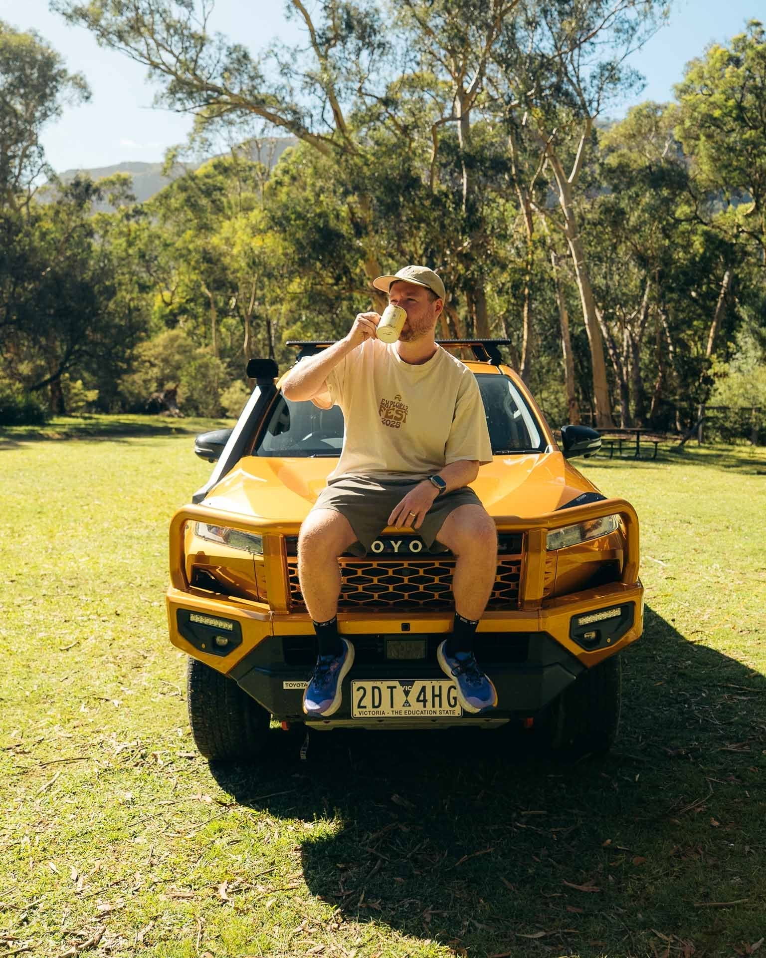 Toyota HiLux, Tim, by Paul, man drinking coffee, yellow adventure truck, bushland, outdoor photoshoot, We Are Explorers