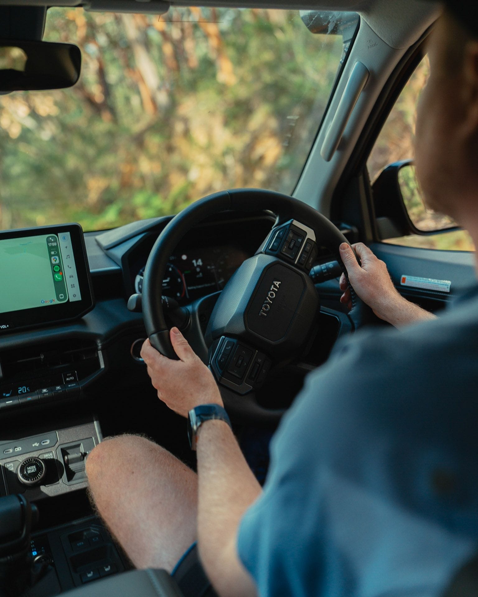 Toyota HiLux interior, driving, by Tim Ashelford, steering wheel, infotainment screen, Google Maps, off-road, 4WD, automatic gearbox