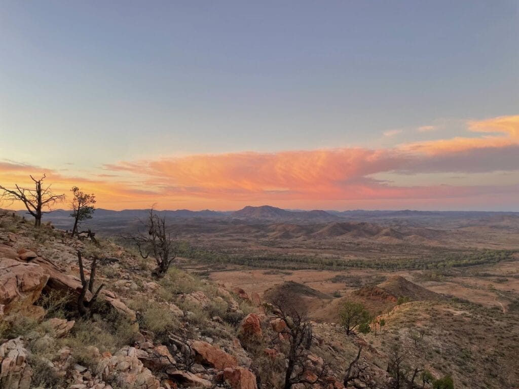 Flinders Ranges, Australia, vast landscape, golden hour, rocky terrain, remote wilderness, arid environment, sunset