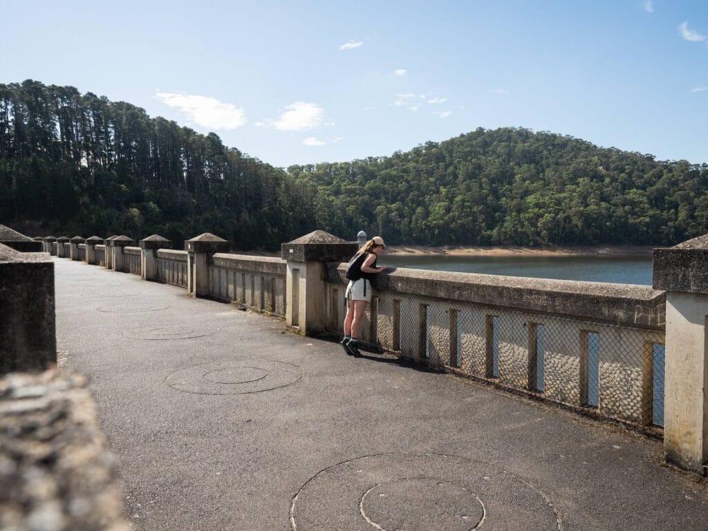 Maroondah Dam wall, Maroondah Reservoir Park, Yarra Valley, Healesville, Victoria, Australia, walking path, reservoir, forest, scenic views, hiking trail, concrete, person