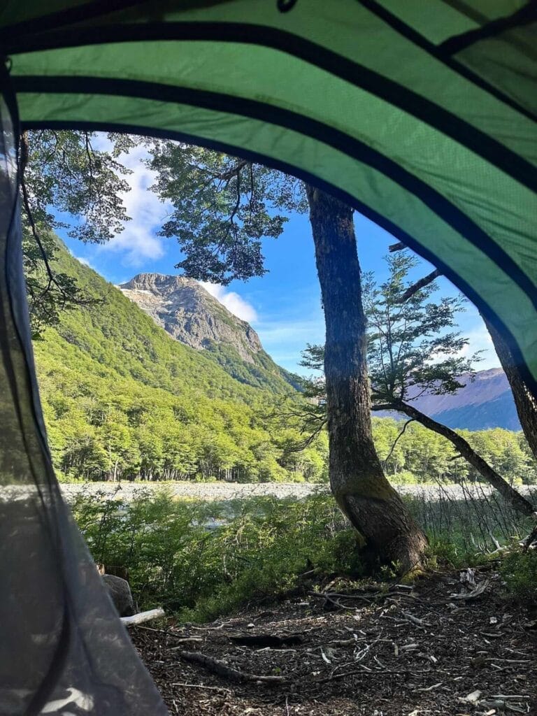 Las Horquetas Trek, Cerro Castillo National Park, Patagonia, by Bea, tent view, mountain, forest, riverbed, blue sky, camping, wilderness