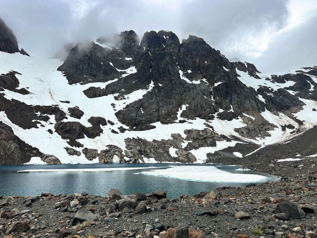 Laguna Duff, by Bea, glacial lake, floating ice, snow-capped mountains, rocky terrain, cloudy sky, Cerro Castillo National Park, Patagonia, Las Horquetas Trek, hiking