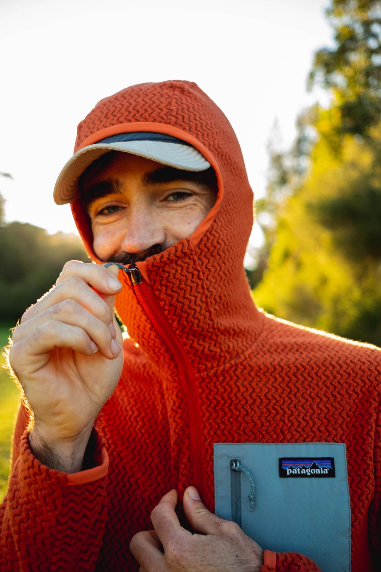 Why Every Explorer Needs a Technical Fleece Like This One, photo by Ella Garbett, model Lachie Hand, R1 Air fleece, orange, cheeky