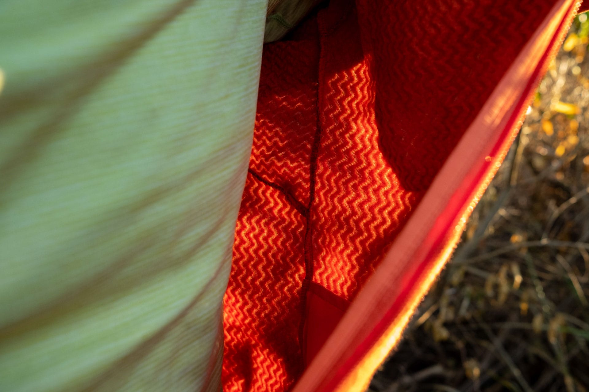 Why Every Explorer Needs a Technical Fleece Like This One, photo by Ella Garbett, model Lachie Hand, R1 Air fleece, orange, light