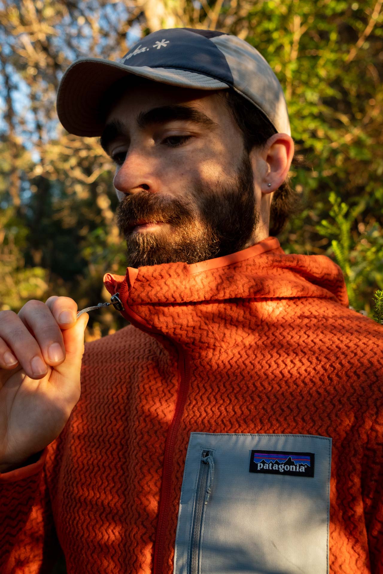 Why Every Explorer Needs a Technical Fleece Like This One, photo by Ella Garbett, model Lachie Hand, R1 Air fleece, orange, zipper