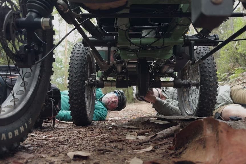 Munda Biddi Trail, off-road wheelchair, The Rig, troubleshooting, repairs, men working, forest, Cowboy Hat Films, Clare Reilly's journey